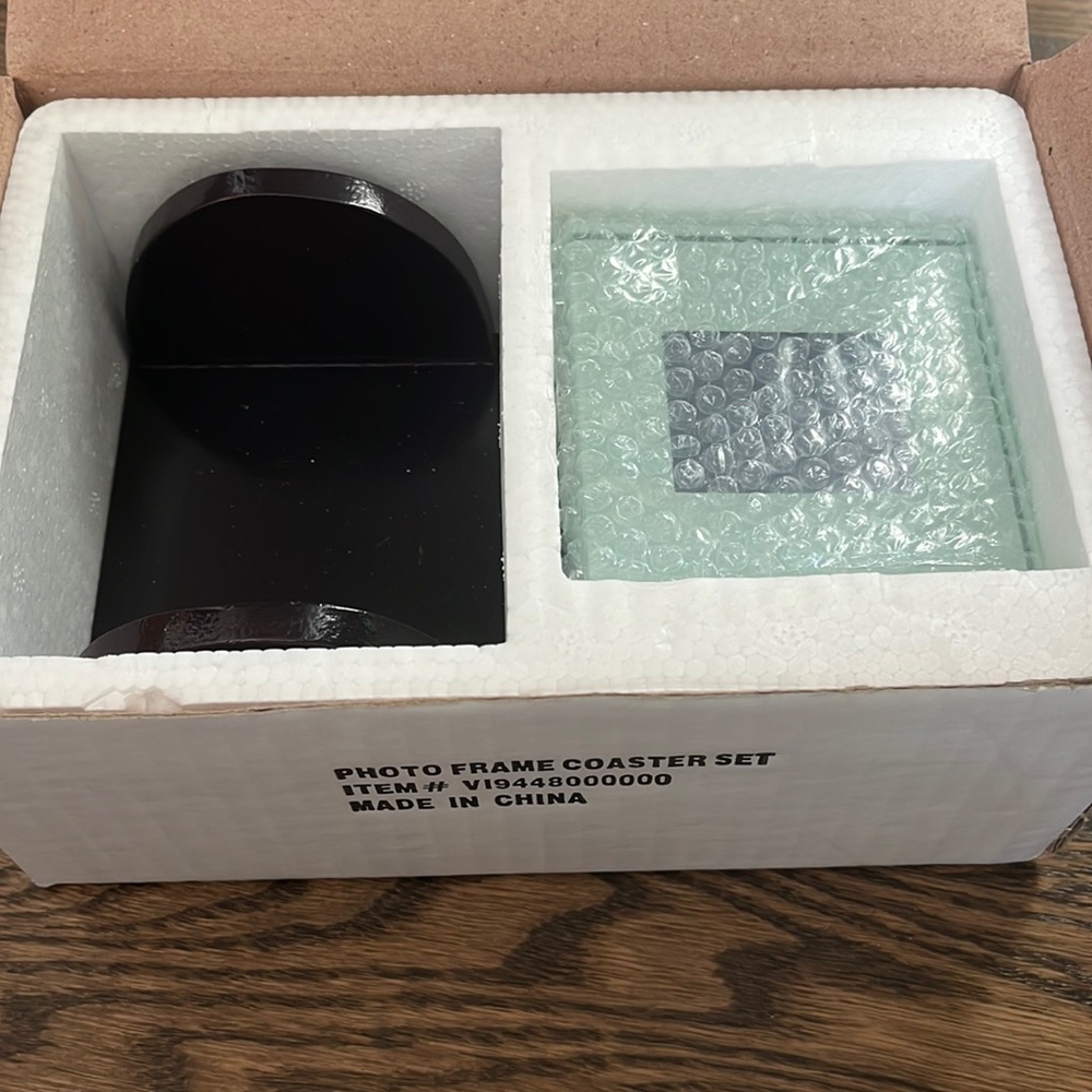 Photo frame coaster set.  New in box.  4 frames.